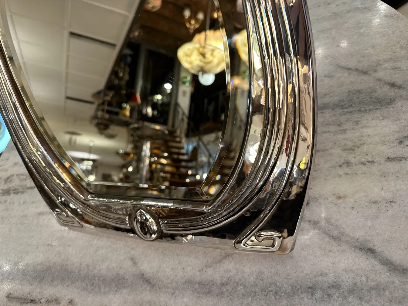 antique mirror with decorative frame in an elegant setting