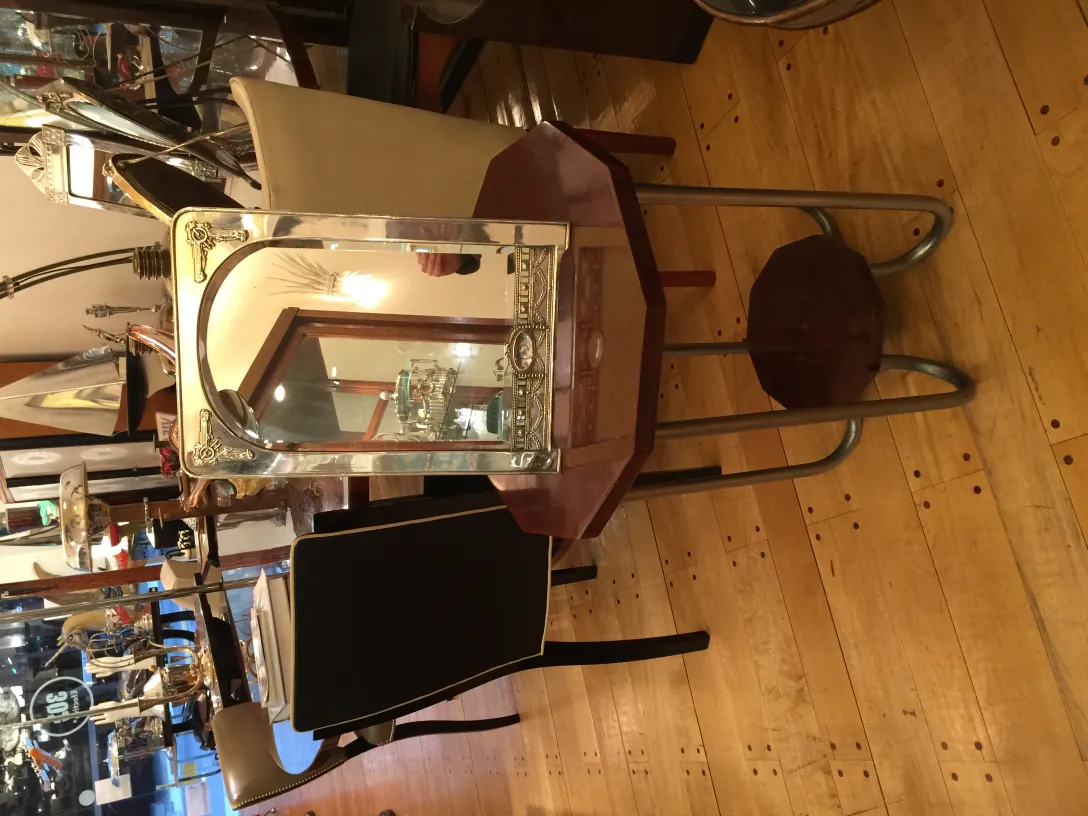 antique table mirror, reflecting decorative surroundings