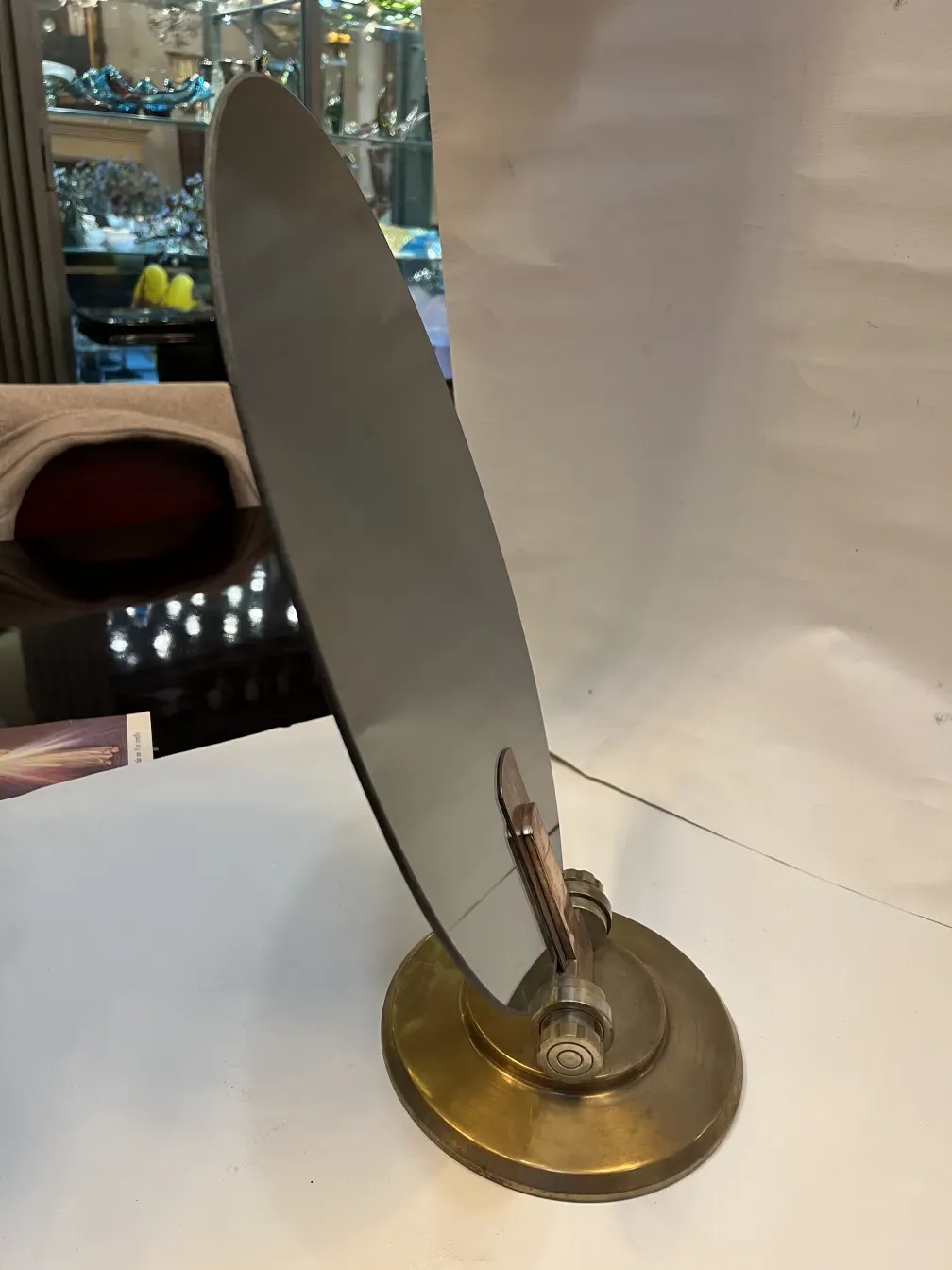 Antique mirror with art nouveau bracket, stylish reflection.