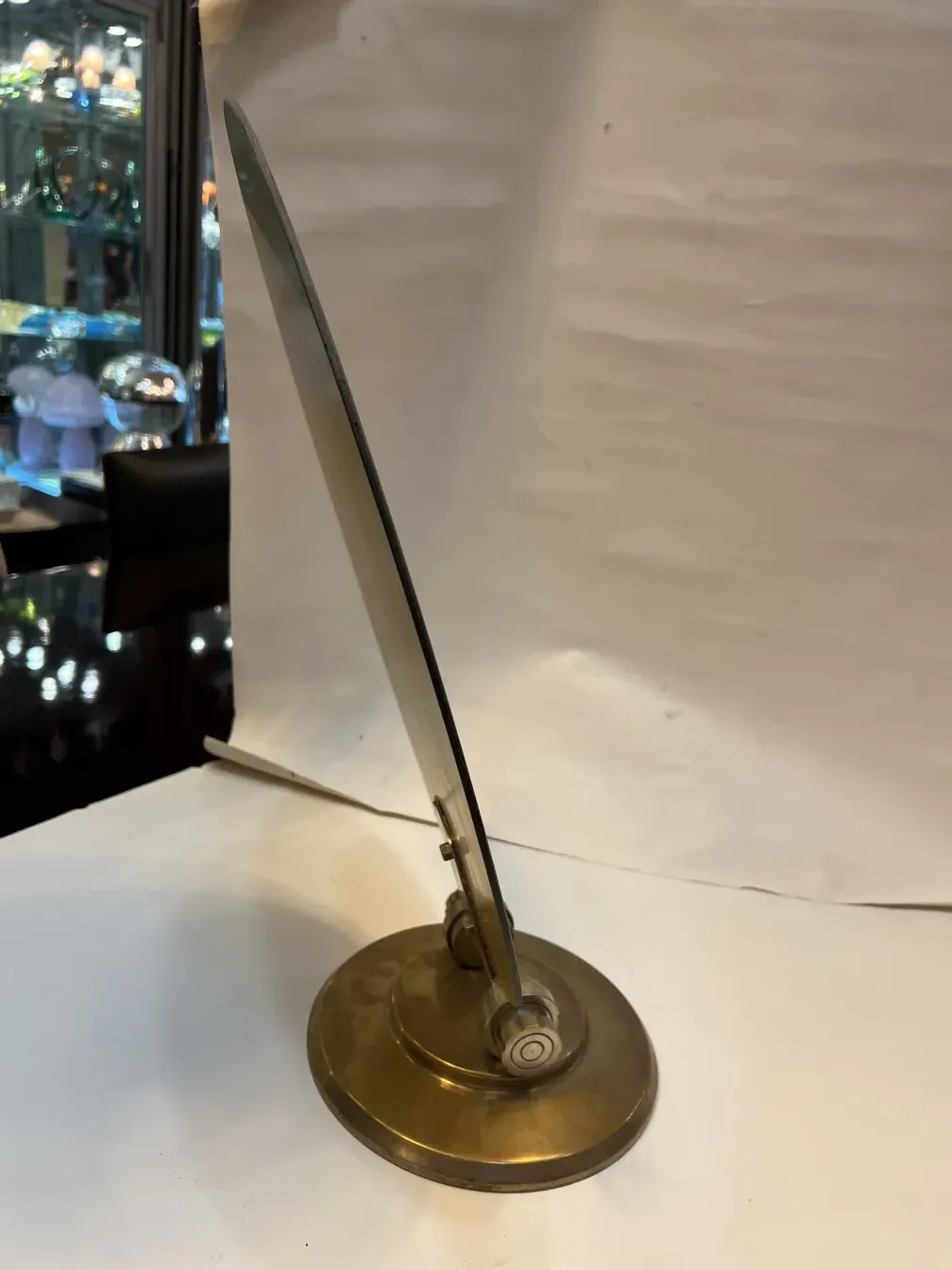 Antique mirror in Art Nouveau style with elegant base.