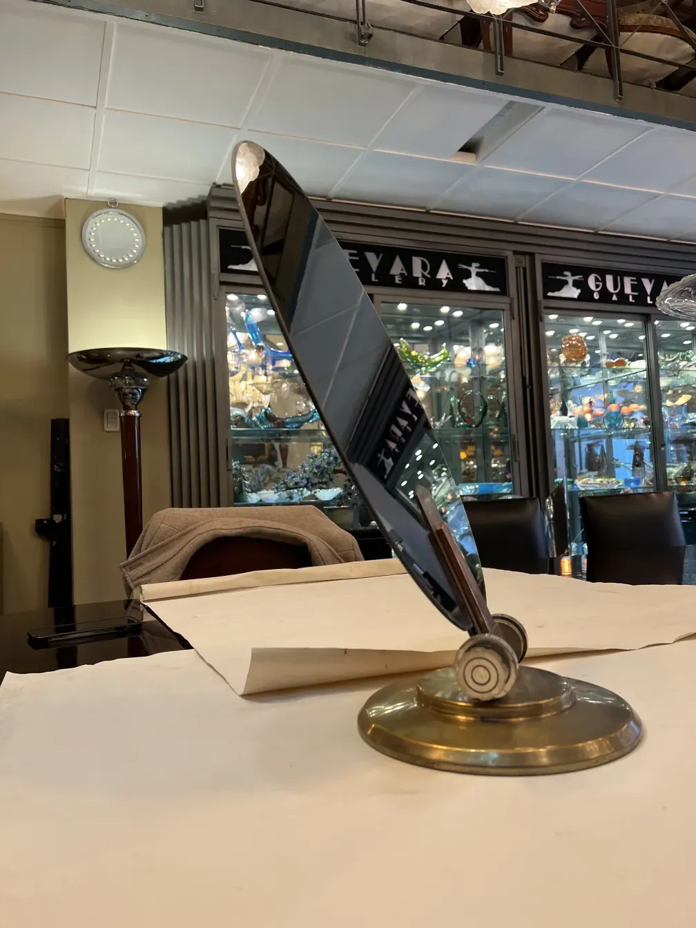 Antique mirror with base, reflective and elegant.