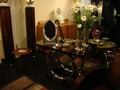 antique mirror with ornamental details in elegant setting