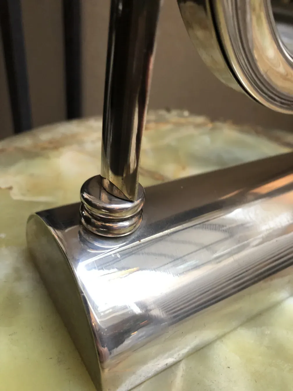 antique mirror with art nouveau details in an elegant setting