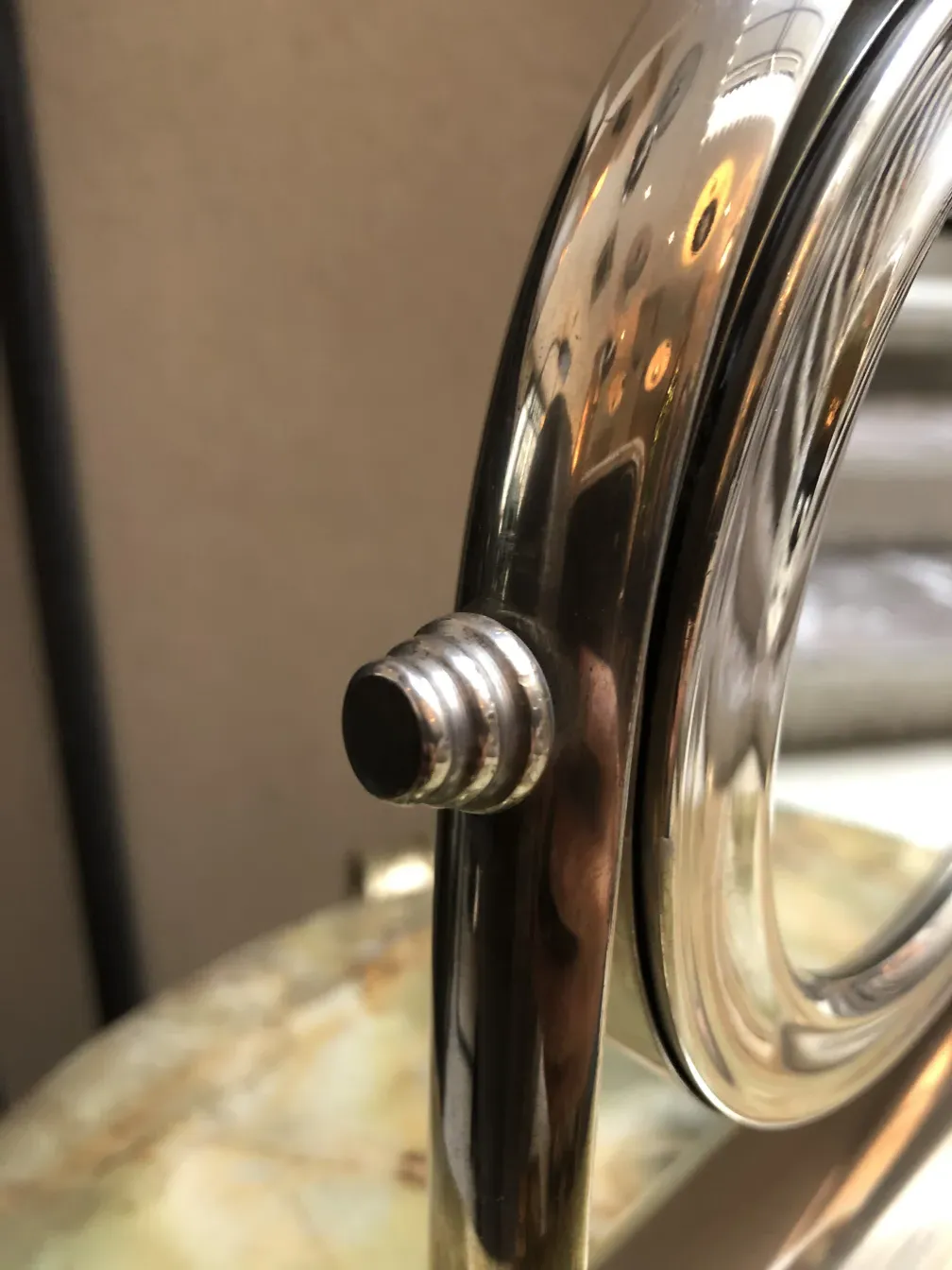 Antique mirror with decorative frame in classic setting.