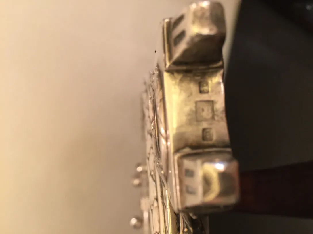 antique mirror featuring art nouveau details and shiny finish