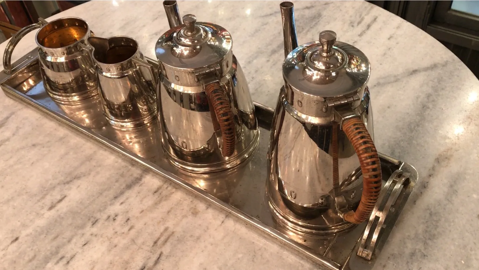 antique WMF tea set featuring shiny teapots on a tray
