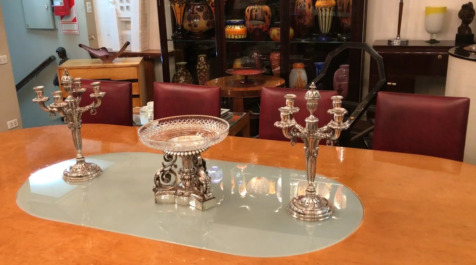 antique christofle centerpiece on table, candelabra and chairs