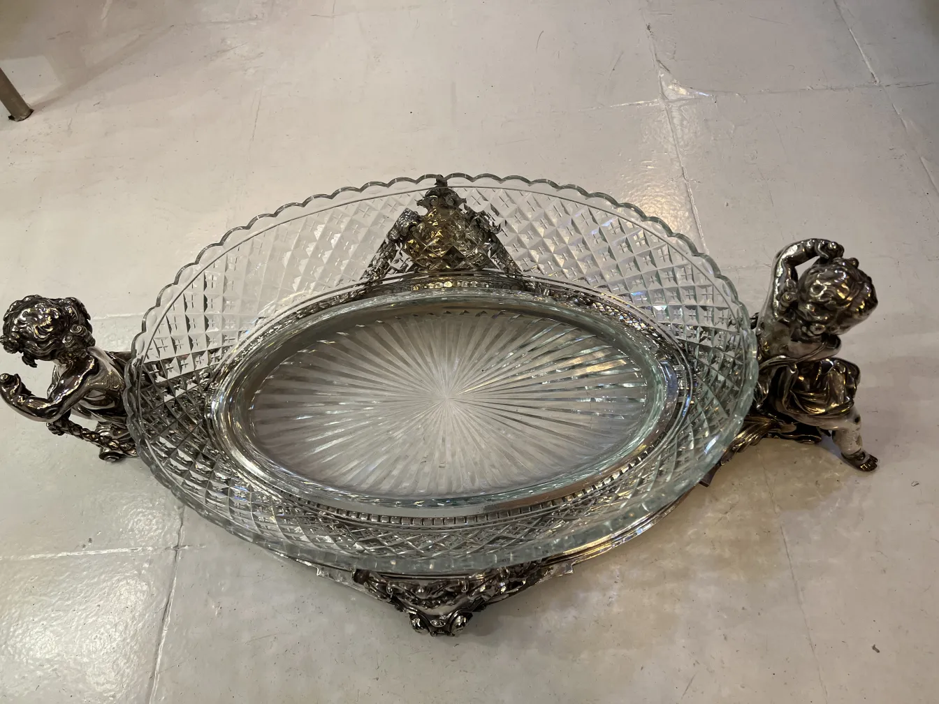 antique centerpiece with ornate details and oval shape