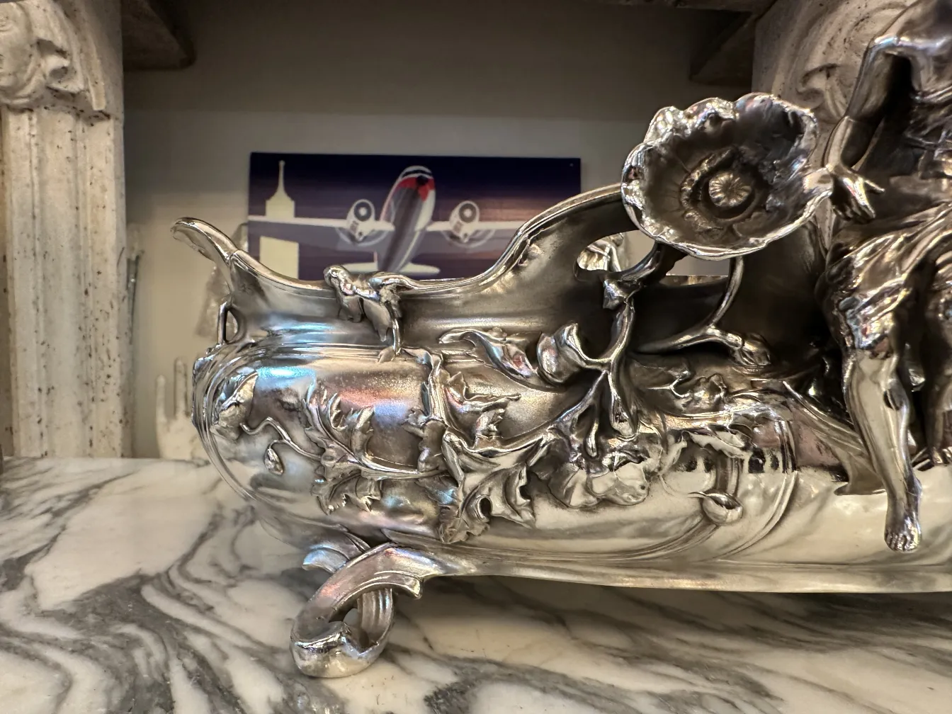 antique centerpiece with floral carvings, shiny and detailed