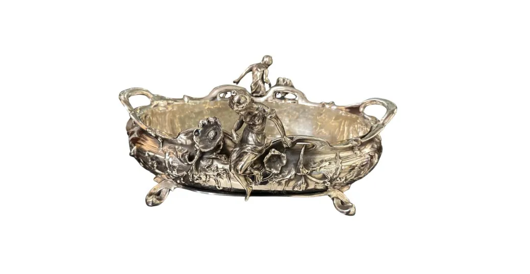 Antique centerpiece with decorative details and figures