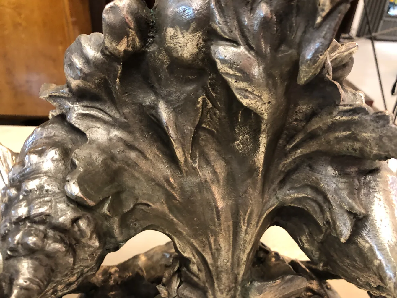 antique centerpiece with floral and leaf design