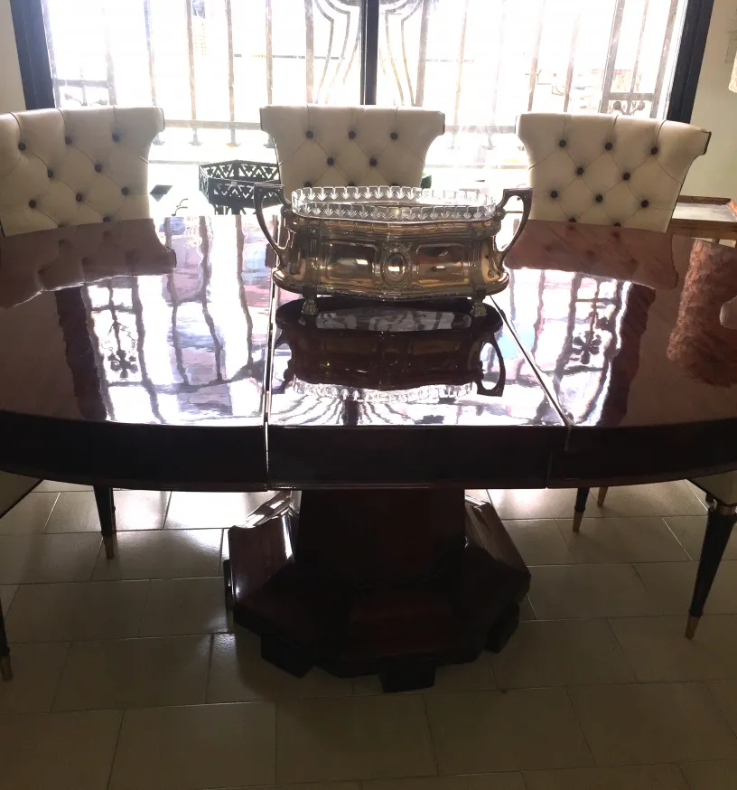 antique centerpiece on an elegant table with chairs