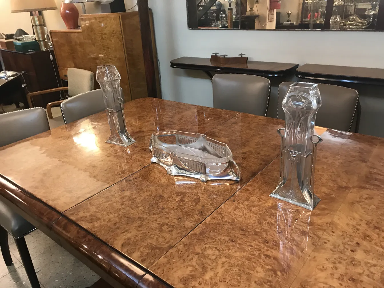 Antique WMF centerpiece on wooden table, decorative and elegant.