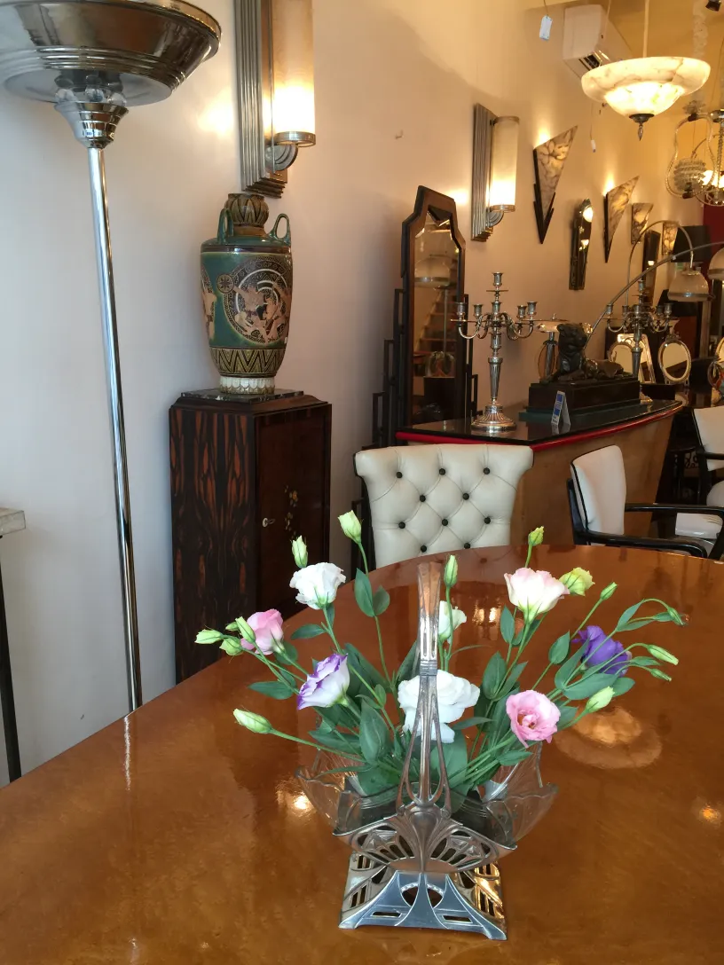 antique WMF centerpiece with colorful floral arrangement on table