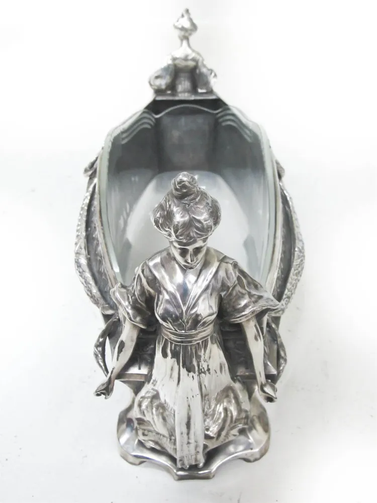 antique centerpiece with female figure and glass insert