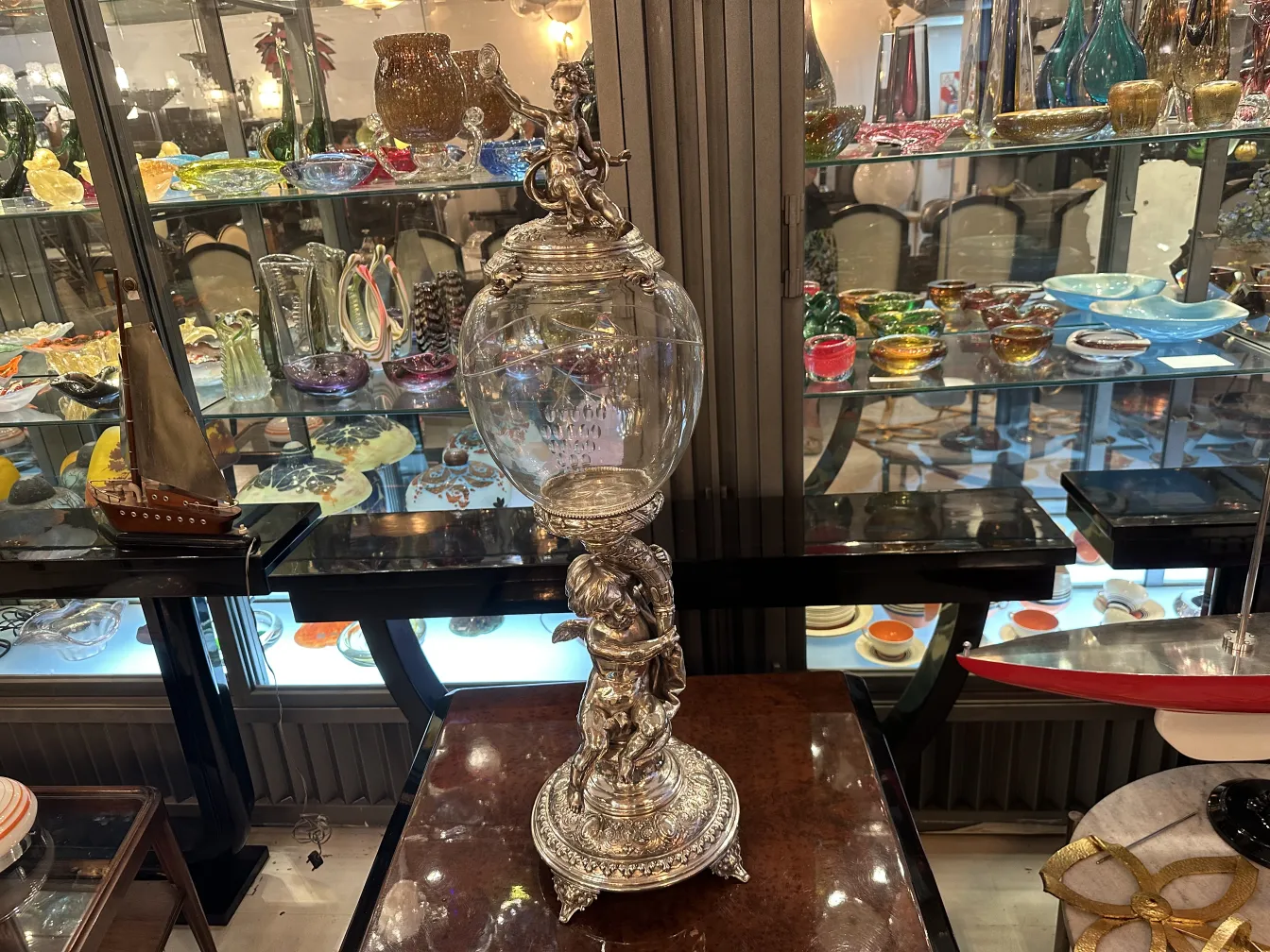 antique WMF centerpiece in elegant setting with boat