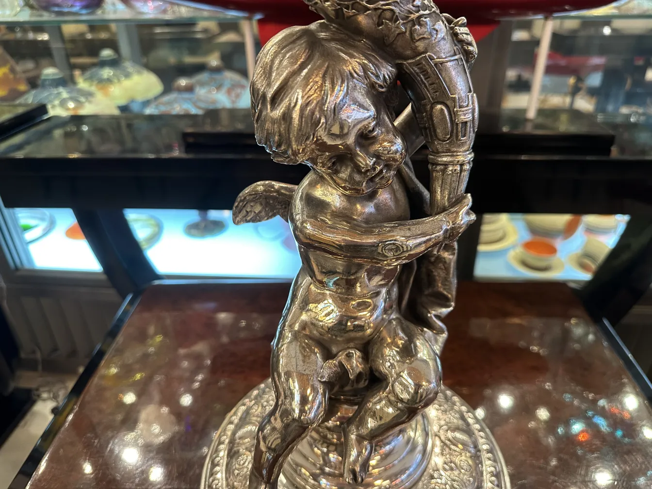 wmf centerpiece with cherub decorative on circular base