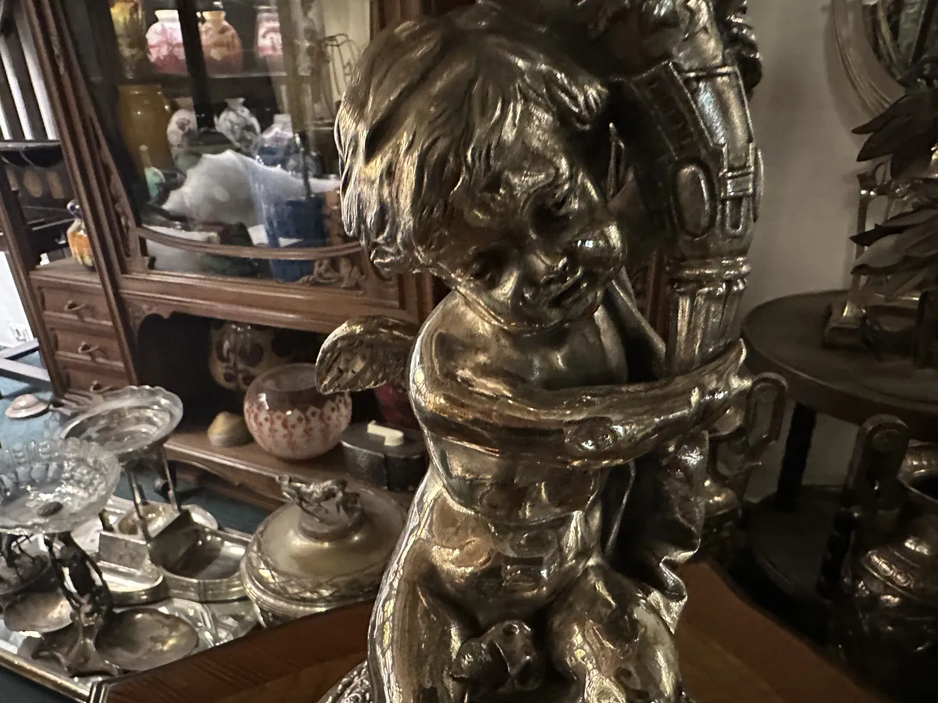 antique WMF centerpiece featuring a cherub, classic setting