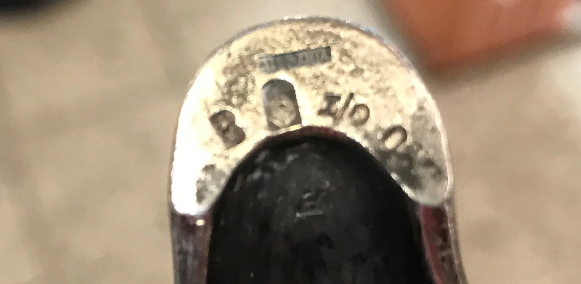 Antique WMF centerpiece with intricate decorative details, surrounded by a cozy environment.