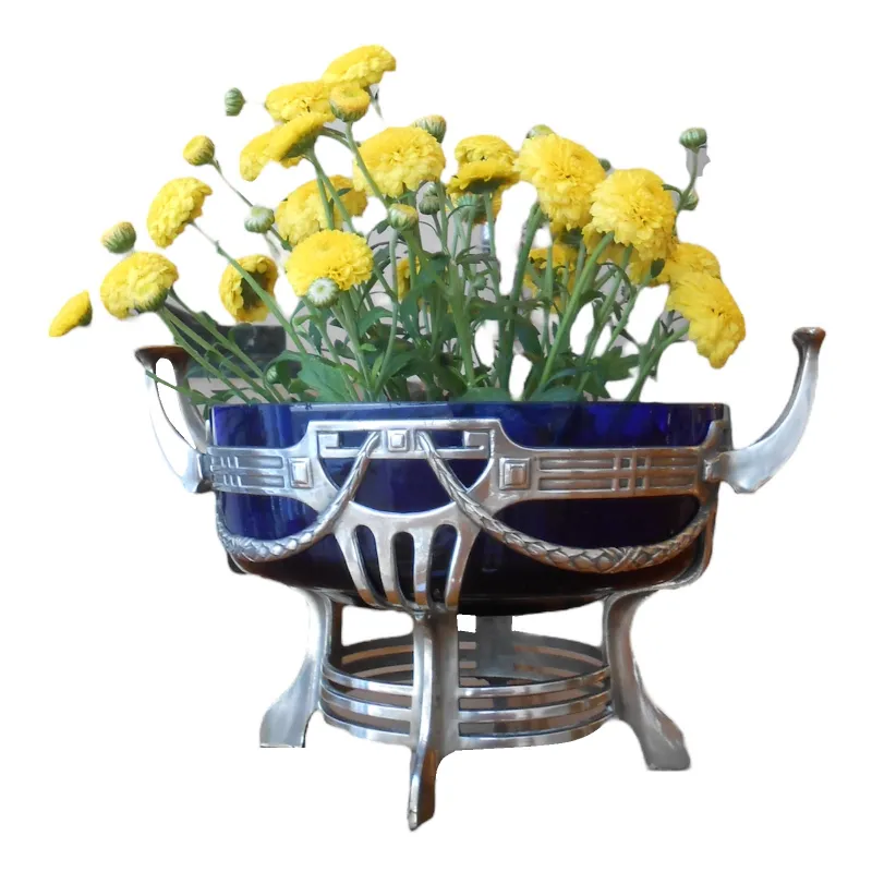antique WMF centerpiece with decorative yellow flowers