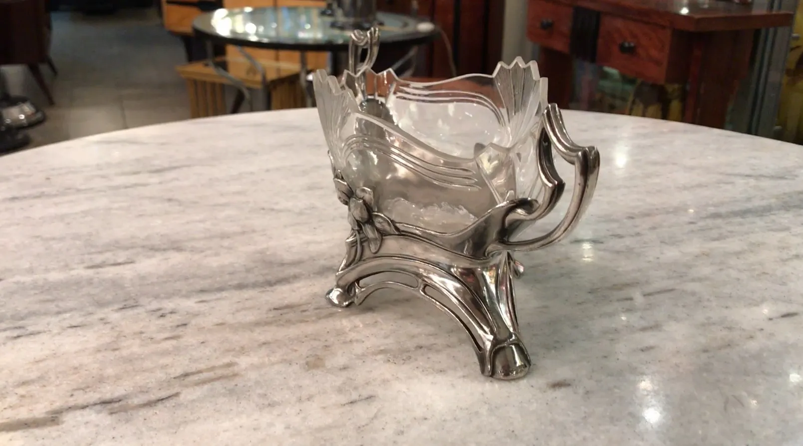 antique WMF centerpiece with elaborate design in an elegant setting