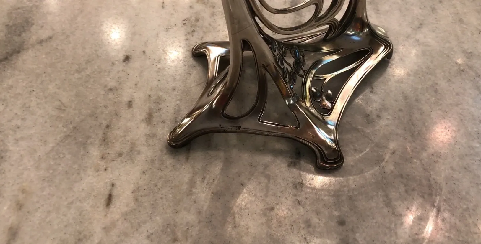 antique WMF centerpiece with intricate design, elegant setting