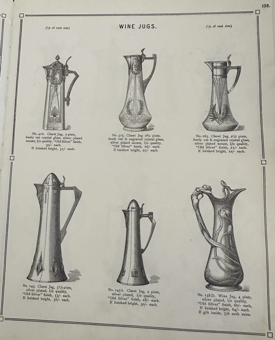 两个古老的WMF水瓶，带有复杂的装饰细节，背景中性。