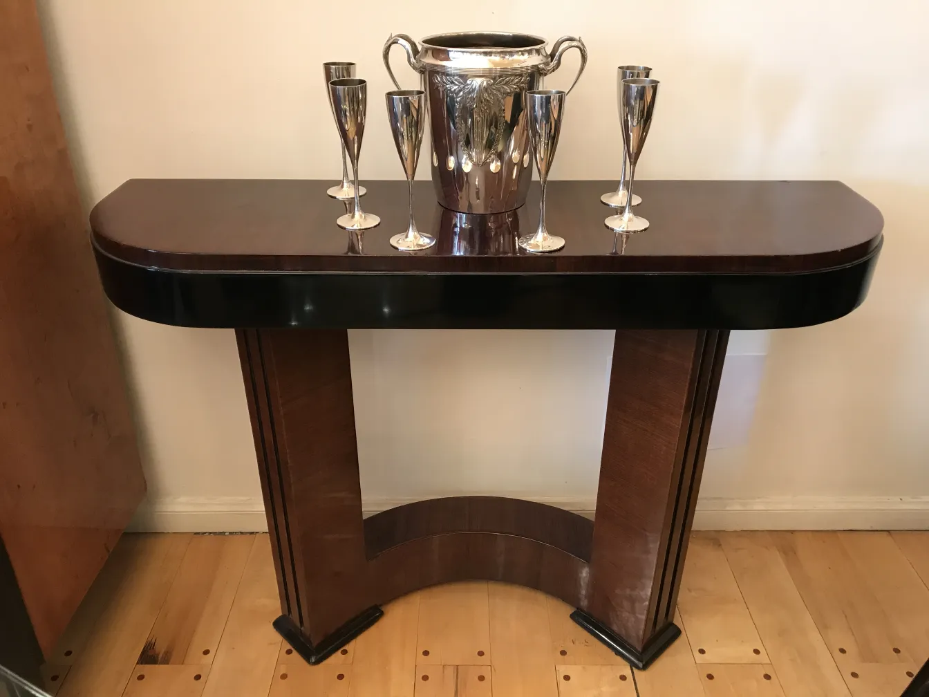 Antique champagne cooler WMF with glasses in a stylish setting.