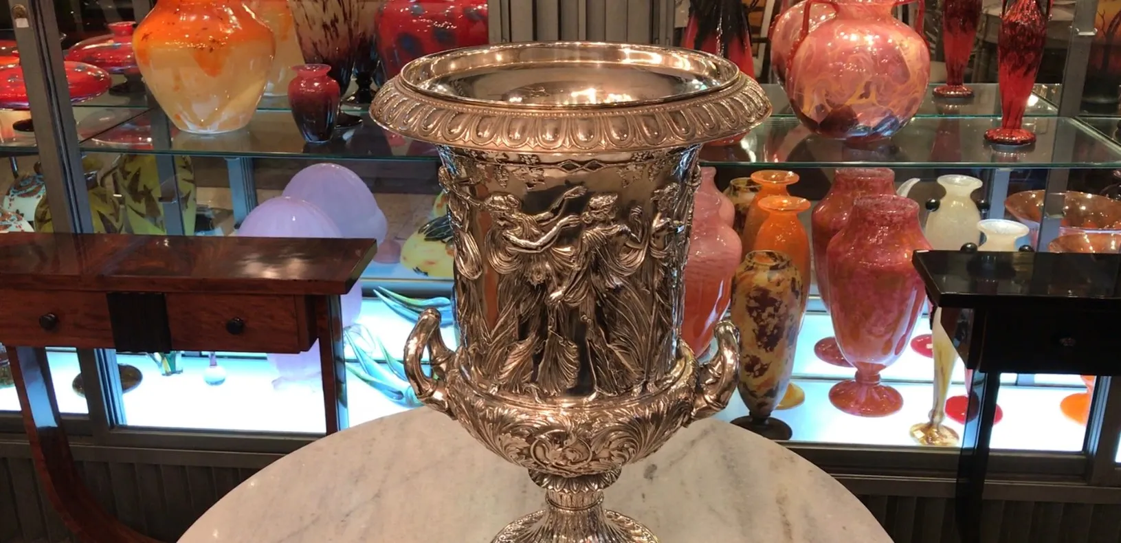 2 vintage champagne coolers wmF with intricate designs, colorful background