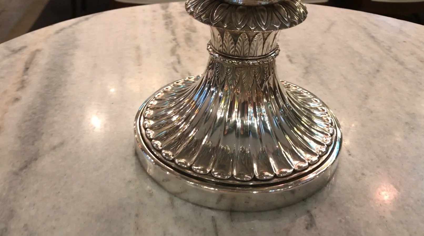 two antique champagne coolers with detailed surface design