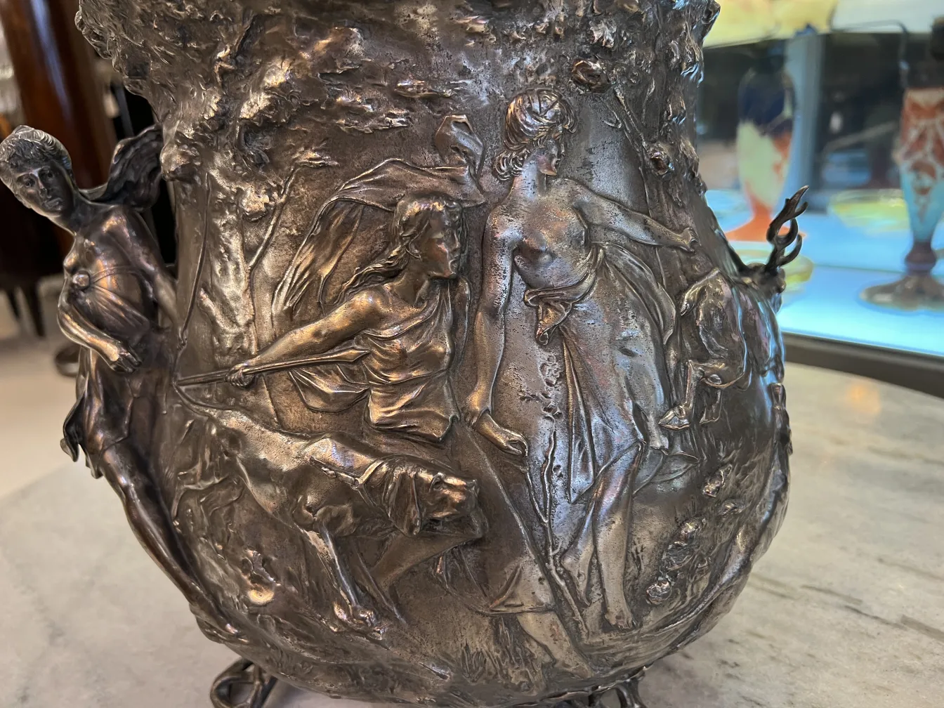 Antique WMF punch bowl with artistic relief and decorative details.