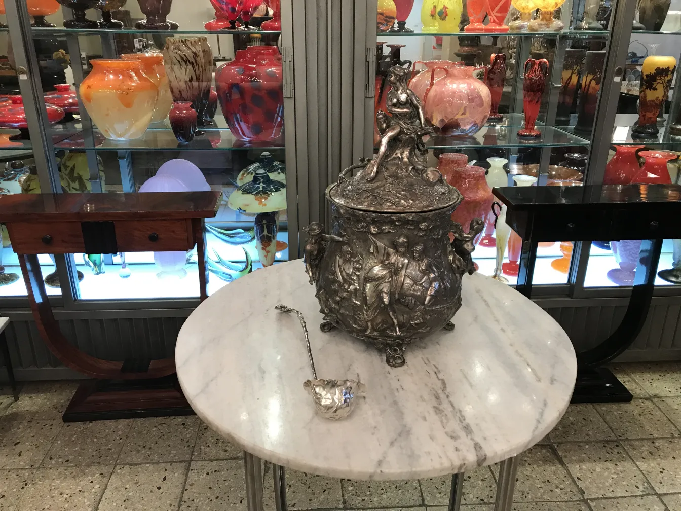 Antique WMF punch bowl with artistic details and spoon.