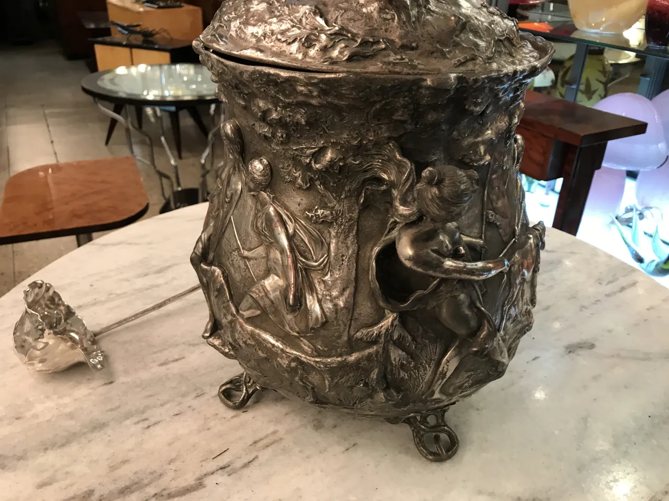 Antique WMF punch bowl with artistic decorations in a stylish setting