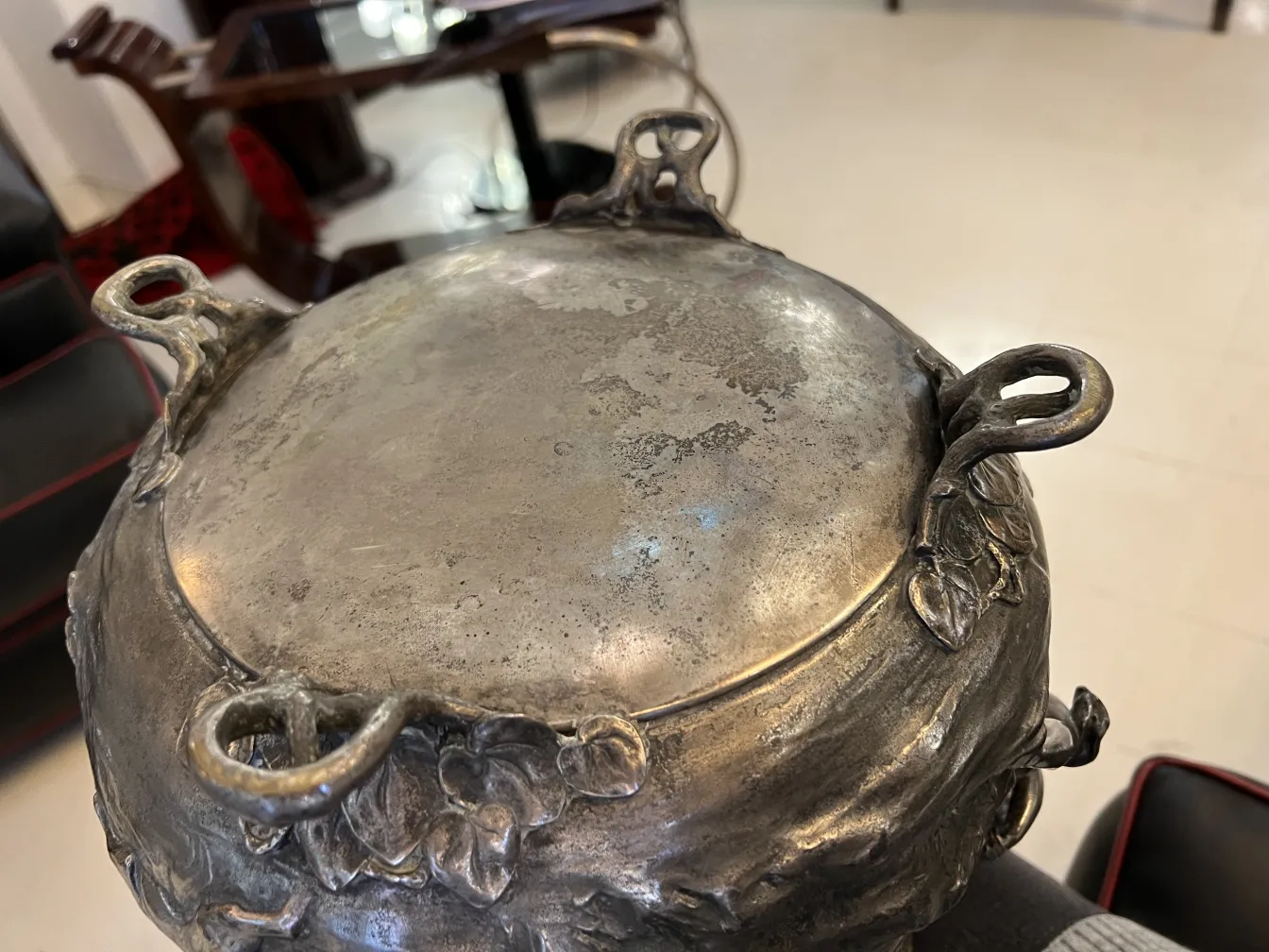Antique WMF punch bowl featuring floral designs on the rim.