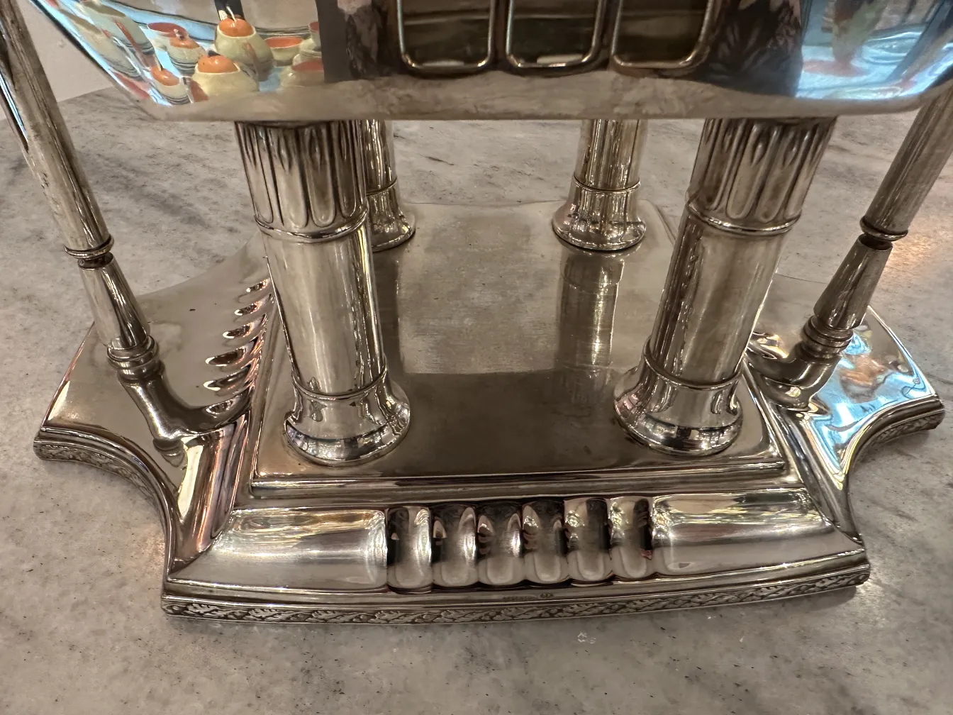 antique WMF punch bowl with decorative stand, light background