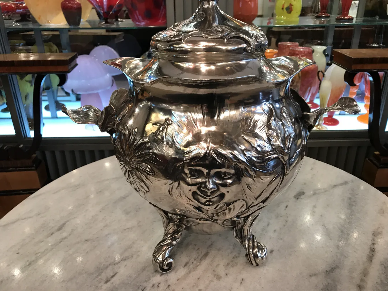 antique punch bowl wmf floral design on marble table with colorful background