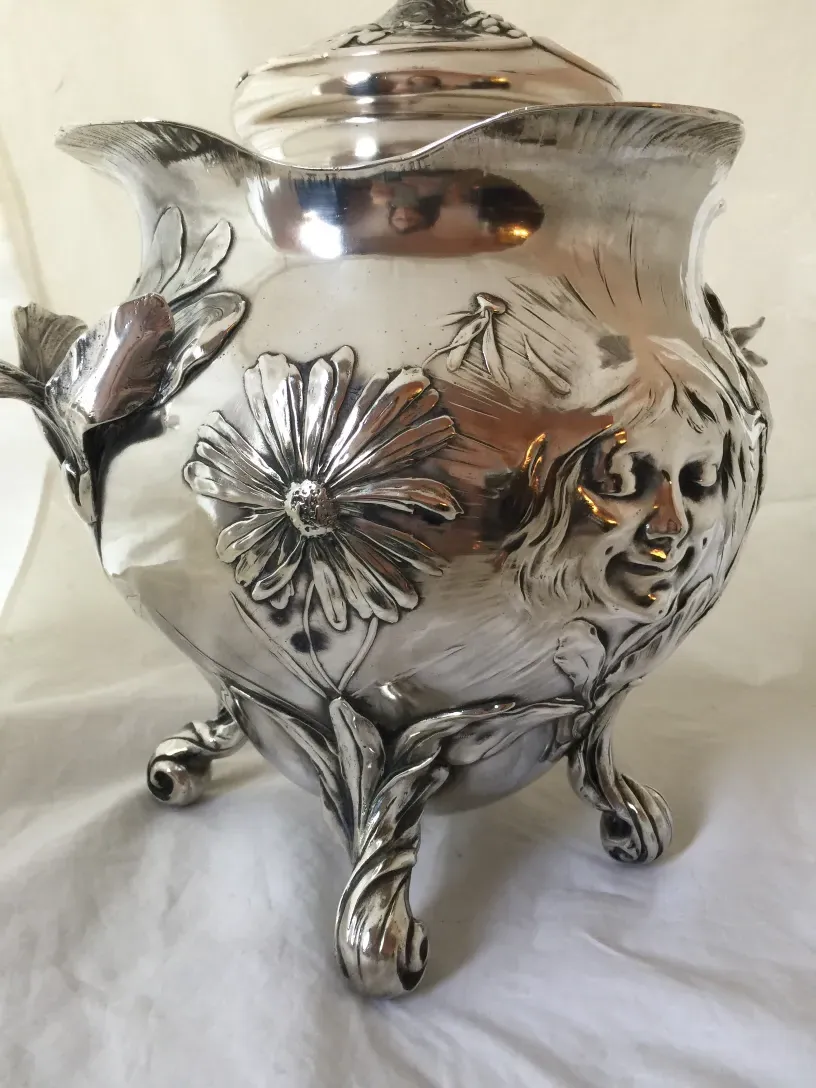 Decorated antique punch bowl WMF with flowers and leaves, elegant design.