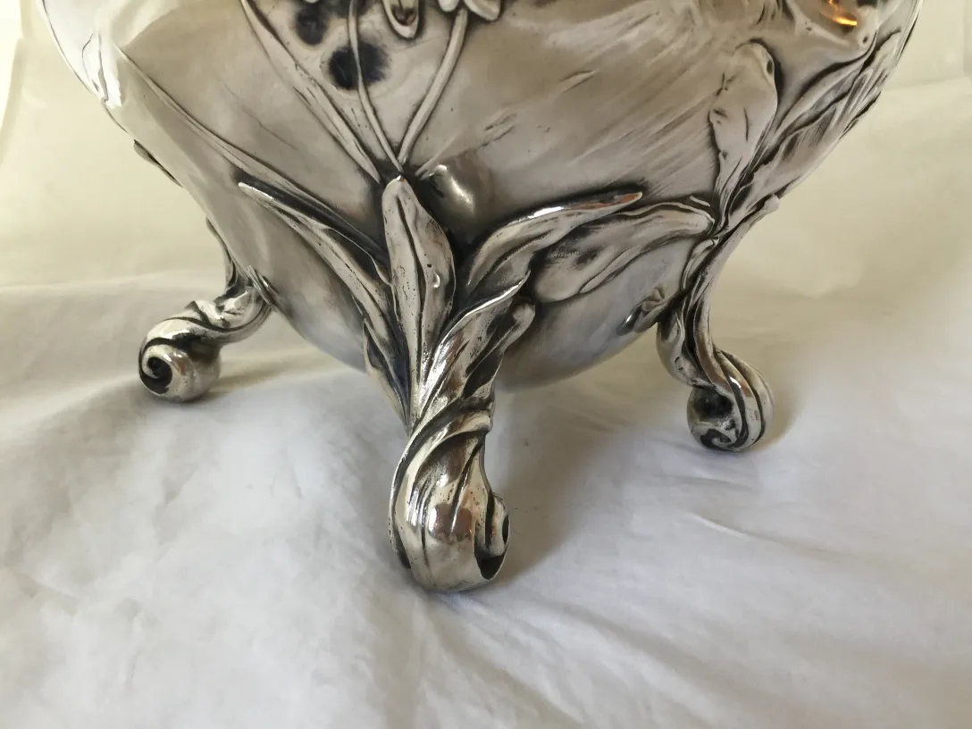 antique wmfi punch bowl with elegant base and floral details