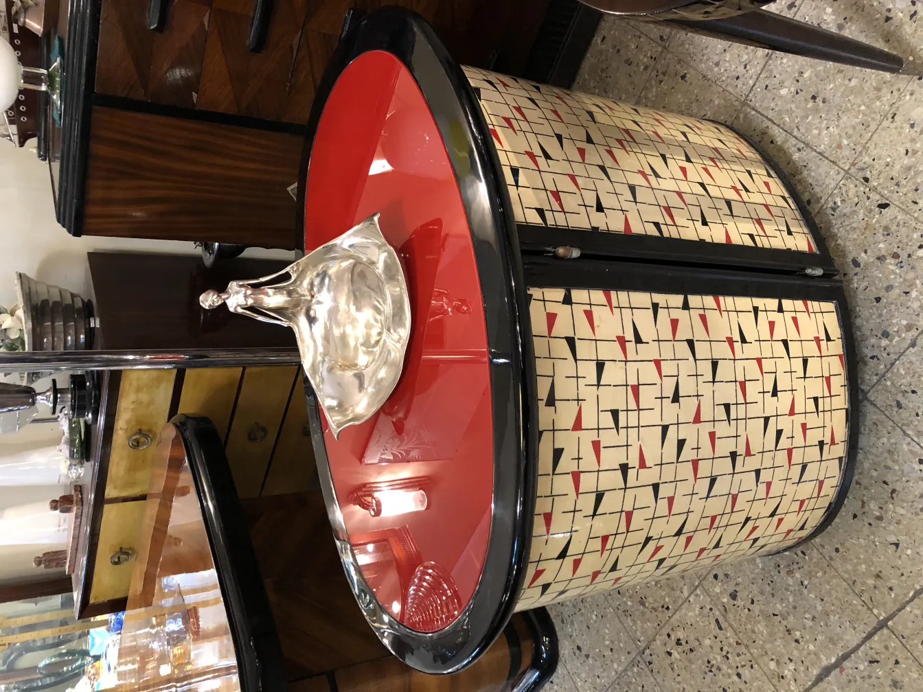 Antique ORIVIT card tray featuring a red surface and graphic patterns.