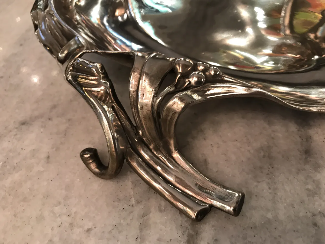 Antique WMF card tray with elaborate design.