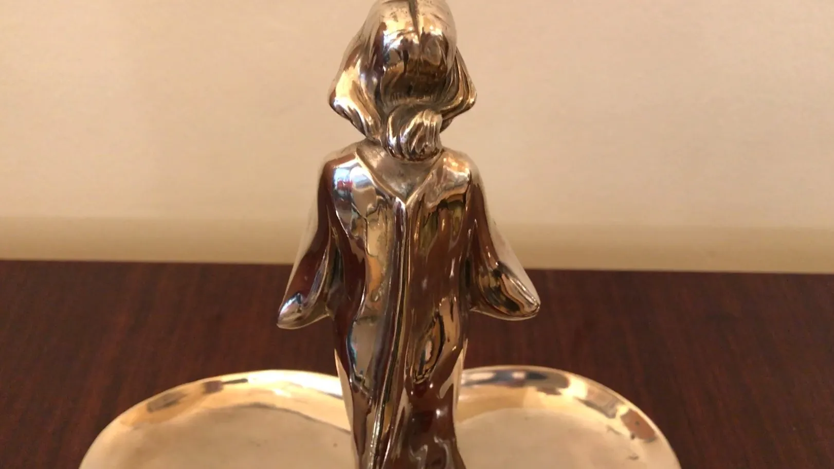 Antique WMF card tray featuring a decorative figure at the center, stylish and distinguished