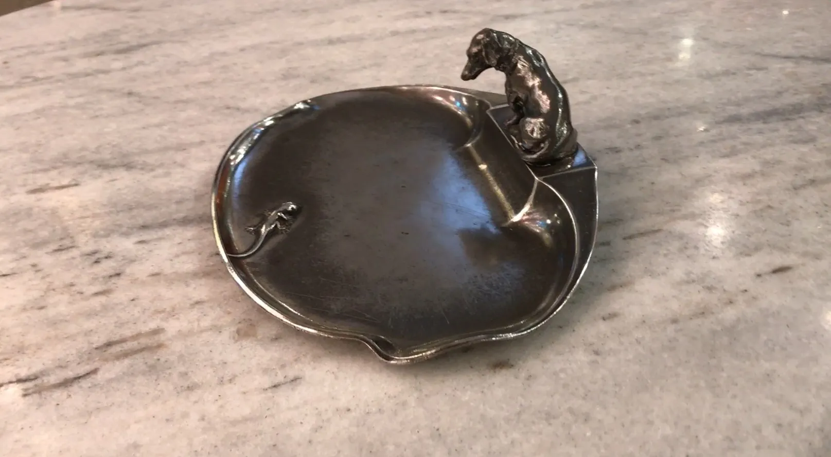 Antique card tray with elegant design and decorative details.