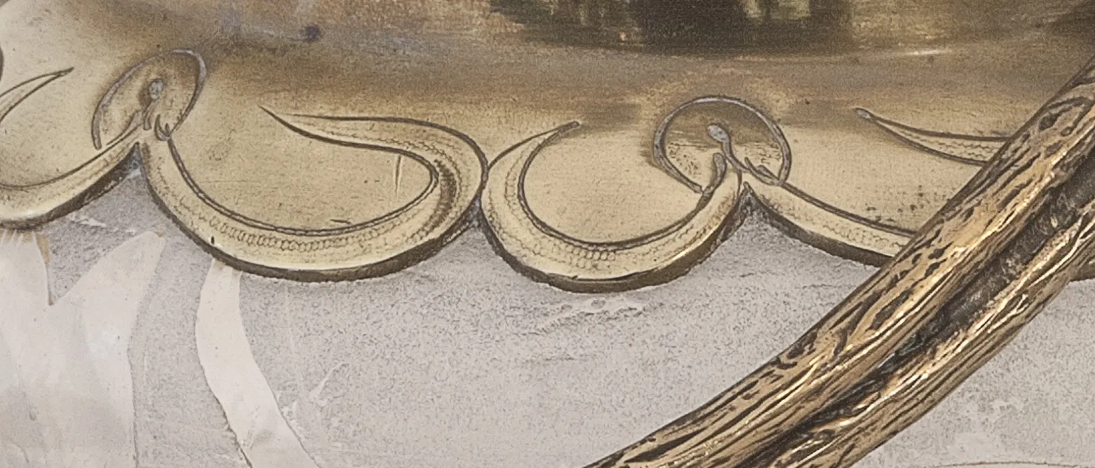 Antique candy box featuring a decorative gold and silver design