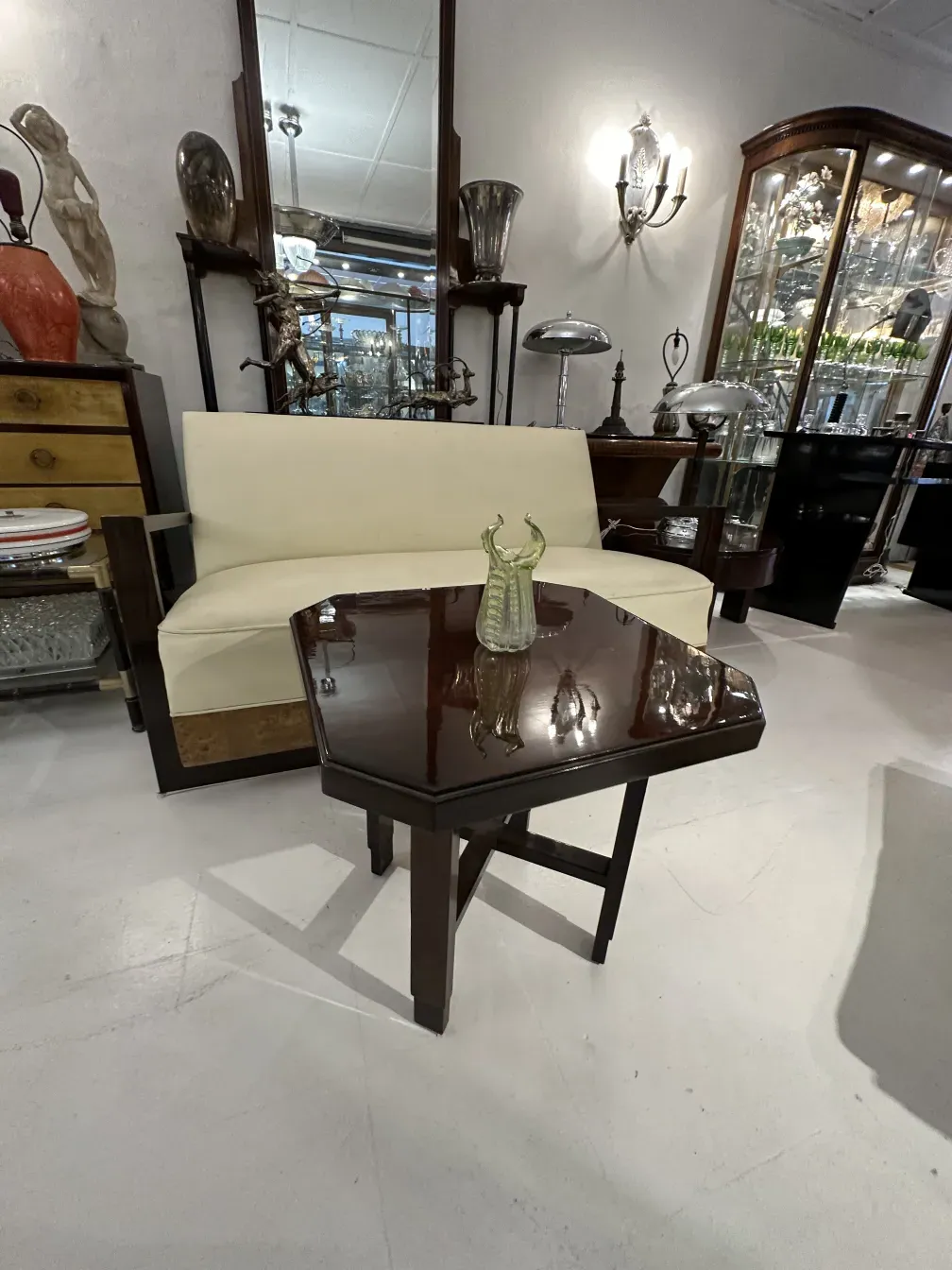 antique armchair with cushion, surrounded by decor