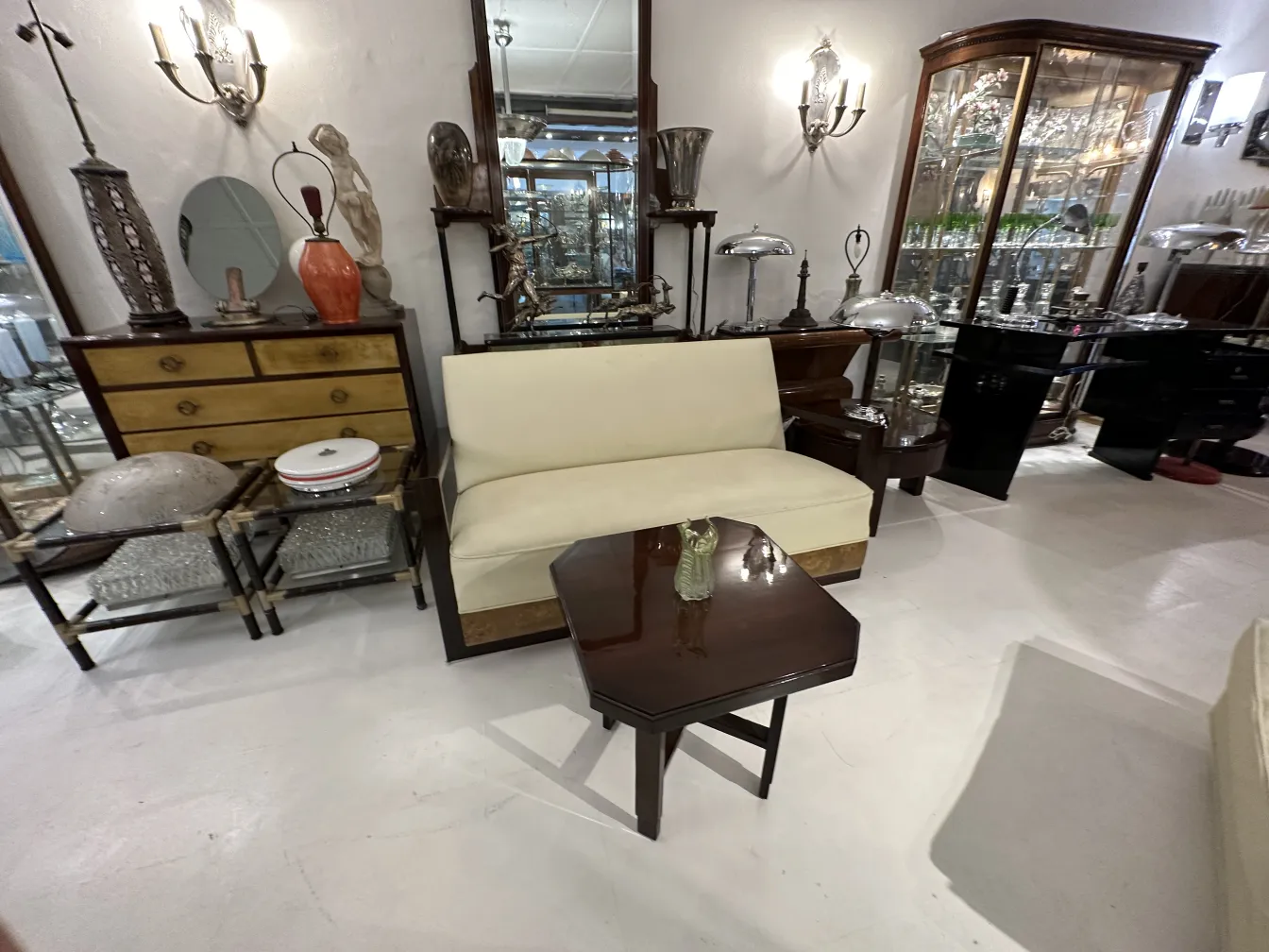 Antique comfortable armchair in an elegant setting with side table.