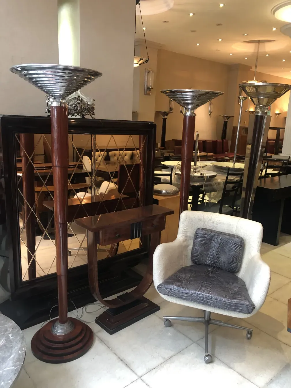 Antique armchair with elegant design and light color in contemporary setting.