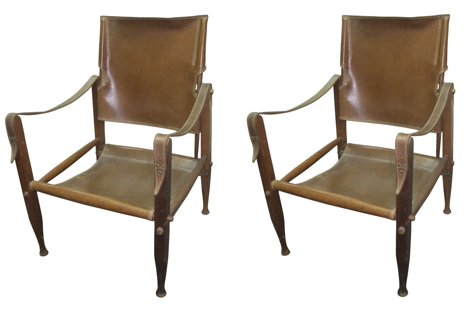 Two antique armchairs with a distinctive design by Kaaren Klint in a classic setting.