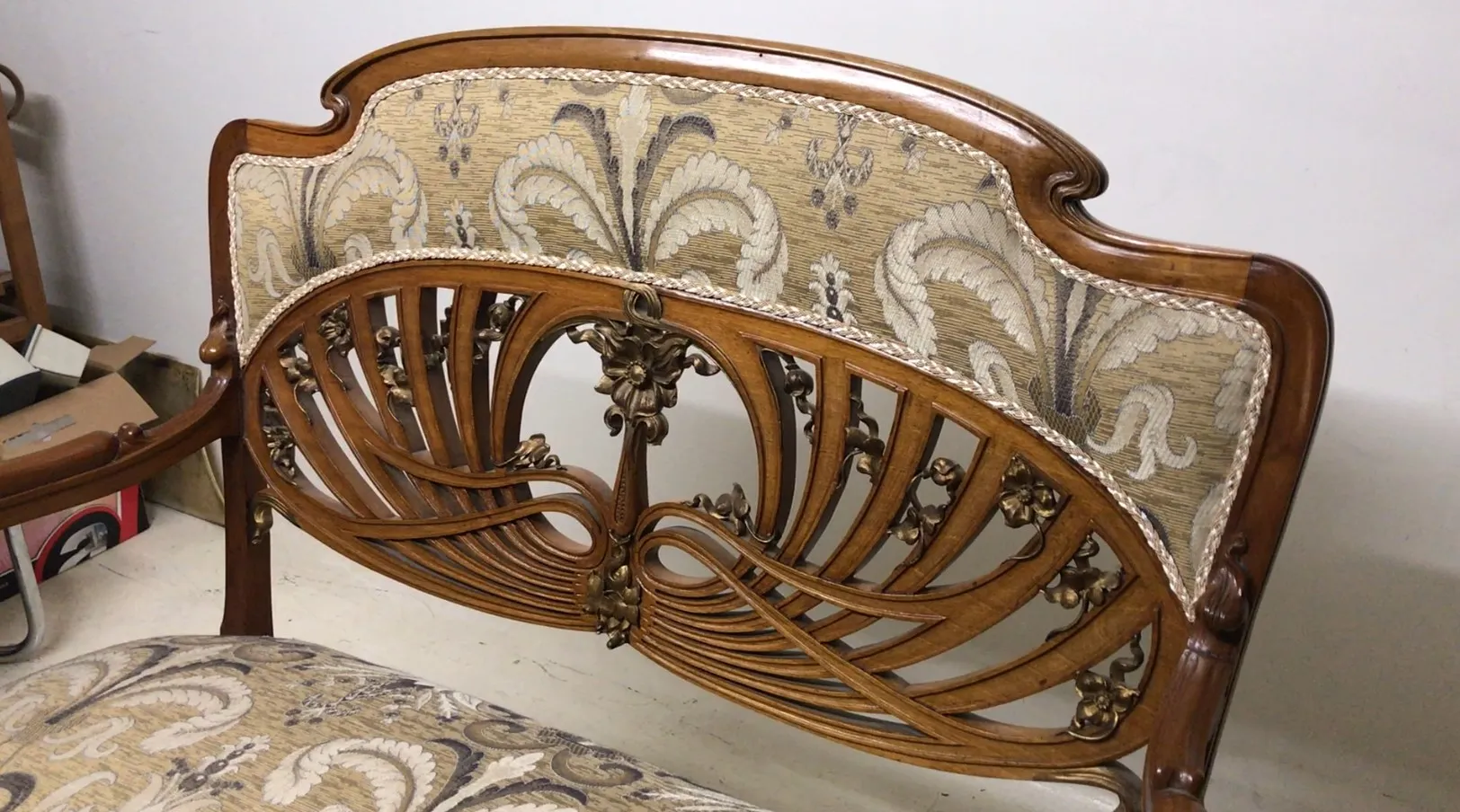 Three vintage armchairs featuring splendid art nouveau design in a cozy environment.