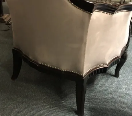 Three antique armchairs featuring ornamental details by Paul Follot.