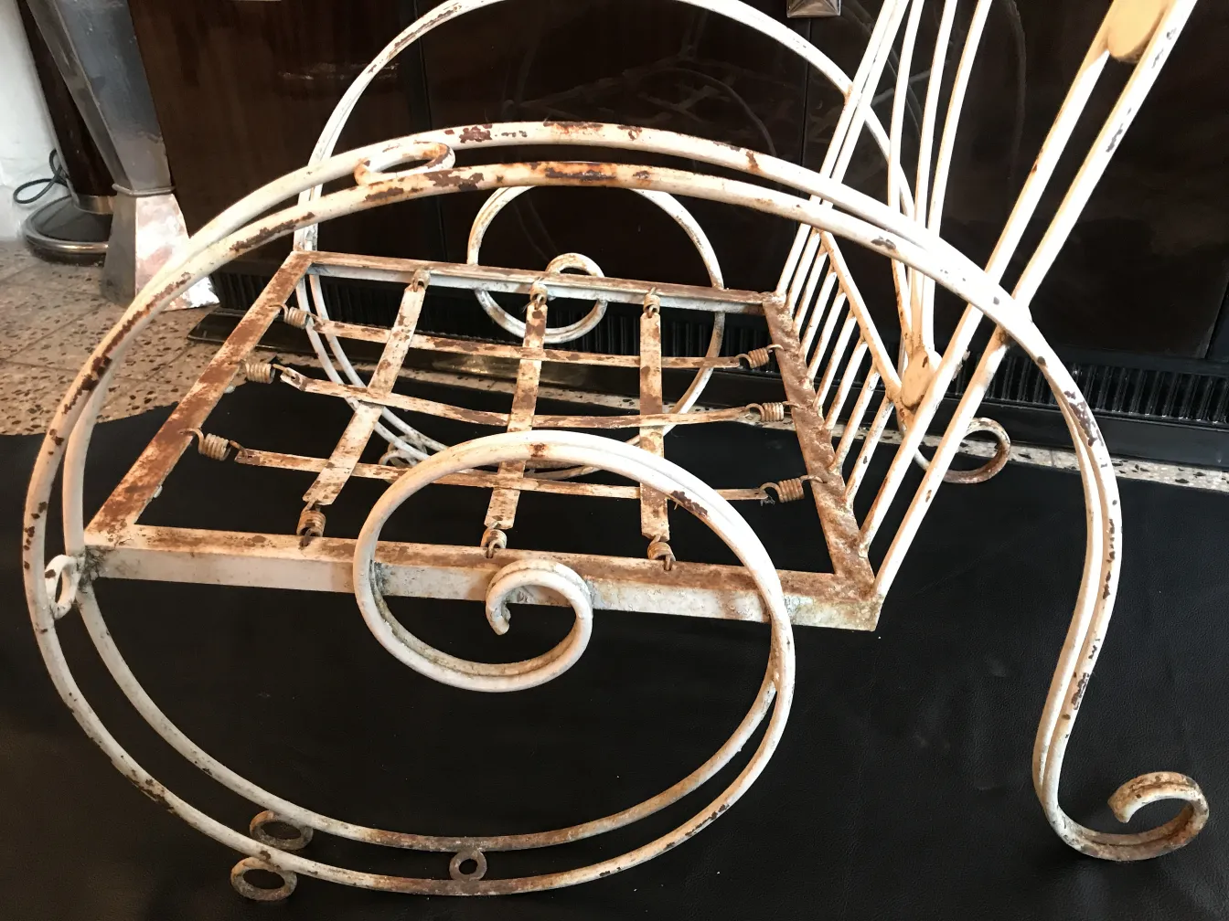 Three antique garden armchairs with curved design and details